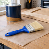 Wadfow 63mm oil-based paint brush resting in an organised home refinishing workspace