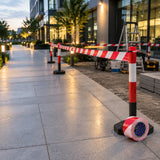 Completed red and white Wadfow safety tape perimeter separating a commercial maintenance area from a walkway