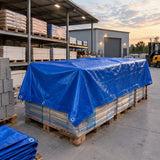 Wadfow blue polyethylene tarp covering a palletised material stack in an organised contractor storage yard