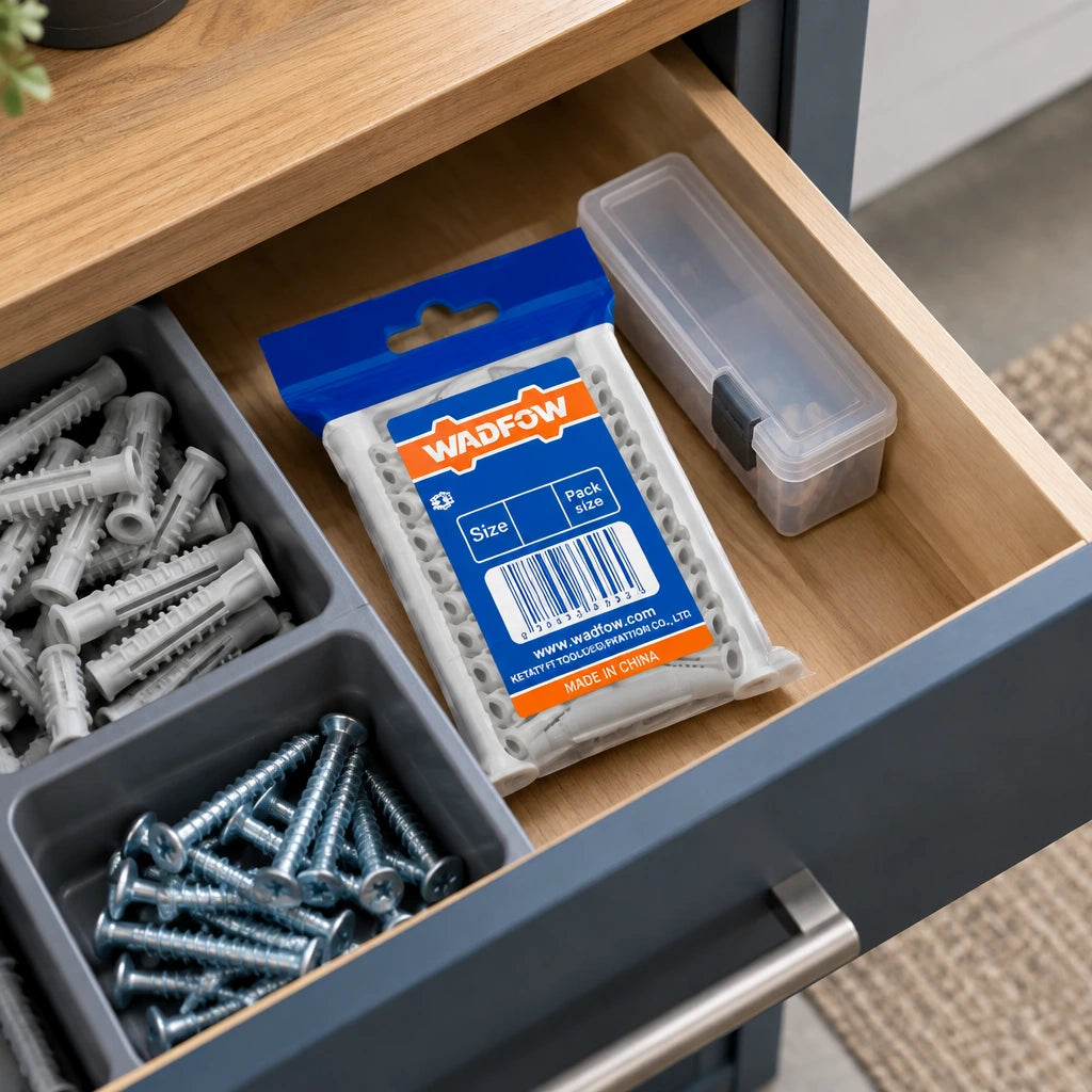 Unopened Wadfow 10 x 60mm grey wall-anchor pack stored in an organised home hardware drawer