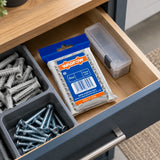 Unopened Wadfow 10 x 60mm grey wall-anchor pack stored in an organised home hardware drawer