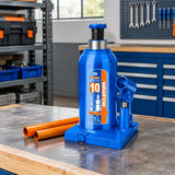 Wadfow 10-ton hydraulic bottle jack stored upright on a workbench in an organised maintenance workshop