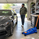 Serviced low-clearance coupe ready in a tidy workshop with the Wadfow WHJ2535 floor jack parked nearby.