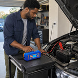 African American vehicle owner uses a Wadfow WBY15041 charger to charge a 12V car battery in a clean garage