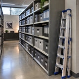 Organised archive shelving with a folded Wadfow WLDF082 ladder resting nearby