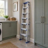 Folded Wadfow WLDF082 aluminium ladder stored upright in a contemporary utility room