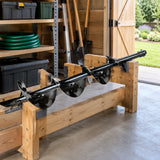 Wadfow earth auger bit stored horizontally in an organised landscape-maintenance shed