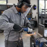 African American metal-fabrication specialist using a Wadfow WAC1347 disc on an angle grinder to dress a steel weld