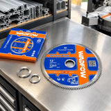 Wadfow aluminium saw blade stored with reduction rings on an organised architectural joinery workbench