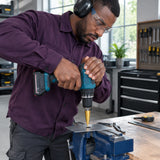 African American metal technician using a Wadfow WJD1403 step drill bit to enlarge a hole in a thin steel plate