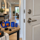 Finished contemporary interior door with installed lock hardware and the Wadfow WKJ2404 hole saw set resting nearby