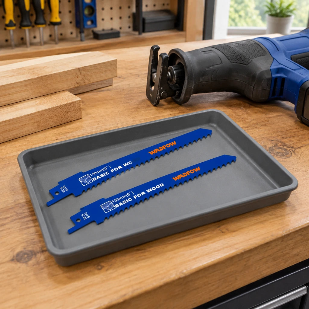 Wadfow WJT611D wood saw blades stored beside a compatible reciprocating saw on an organised carpentry workbench.