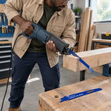 African American carpenter uses a compatible reciprocating saw fitted with a Wadfow WJT611D wood-cutting blade on supported timber.