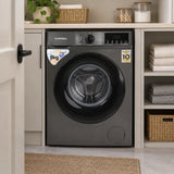 Luxell dark-grey 8kg front-load washing machine resting in a compact contemporary home laundry cupboard.