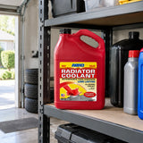 Capped ABRO red radiator coolant jug stored on an organised garage shelf