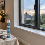 Finished window reveal with neatly trimmed cured PU foam and a EuroSil 750ml can nearby.