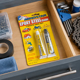 Sealed ABROSTAR ES-501 clear epoxy blister pack stored in an organised home repair drawer