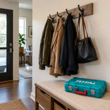 Completed apartment entryway with a wall-mounted coat rack and closed Total THKTHP41667 tool case nearby.
