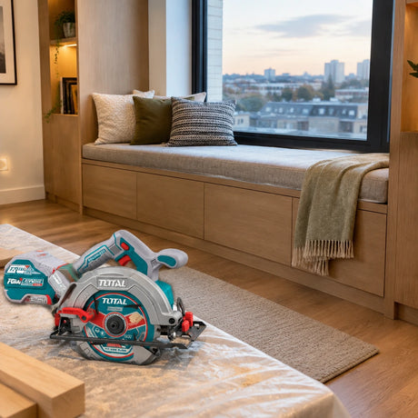 Completed timber window seat with the Total cordless circular saw resting nearby in a contemporary apartment
