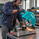 African American fabricator using the Total TS223558 cut-off saw to cut a clamped square steel section