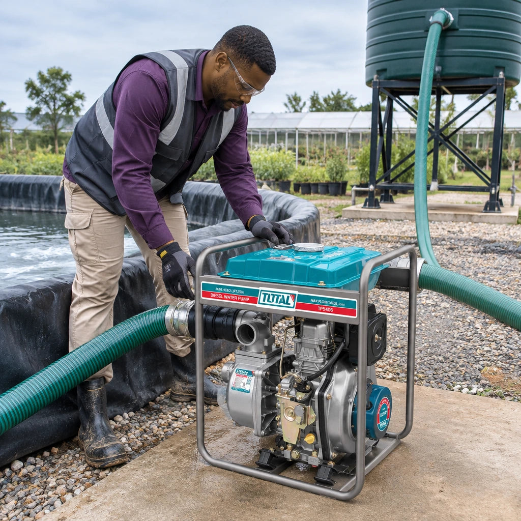 Grounds-maintenance technician using the Total TP5406 diesel pump to transfer water from a reserve tank to an irrigation holding tank.