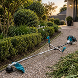 Cleared estate garden border and service path with the inactive Total TP5524421 brush cutter nearby