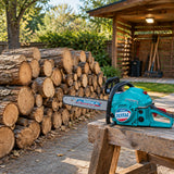 Neatly stacked hardwood rounds with the inactive Total TG5502011 chainsaw beside an orchard service path