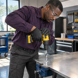 Technician drills a 14 mm hole in a secured stainless-steel panel using the Ingco HSS4341 bit