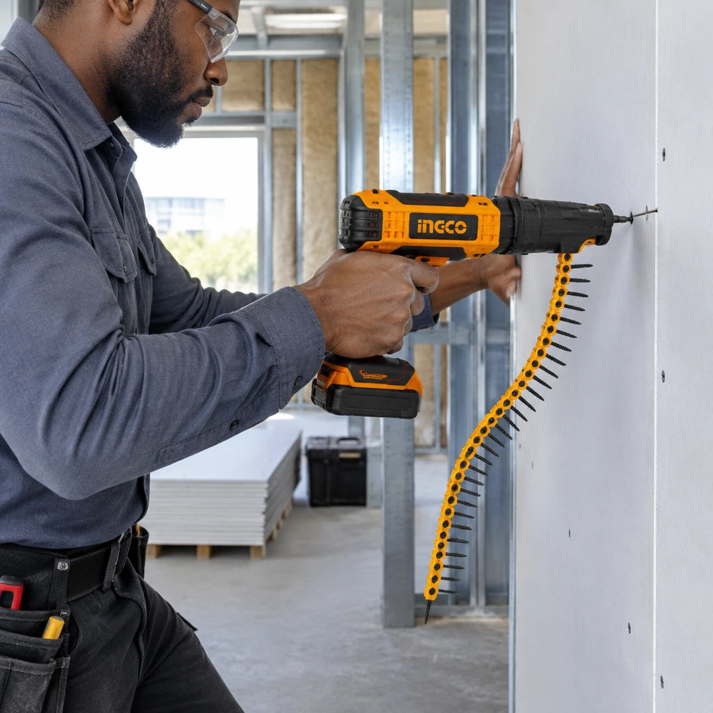 African American drywall installer using a collated screw tool loaded with Ingco ANA19251 screws to fasten a gypsum panel