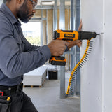 African American drywall installer using a collated screw tool loaded with Ingco ANA19251 screws to fasten a gypsum panel