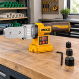 Ingco PTWTLI2018 plastic pipe welding tool resting with its replacement heads on an organised plumbing workshop bench.