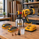 Ingco cordless spray gun kit resting on an organised cabinet-refinishing workshop bench
