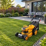 Freshly cut contemporary home lawn with the Ingco LMLI4020 cordless mower parked beside the finished garden