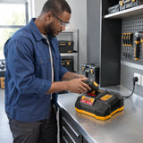 Maintenance technician placing a compatible 42V battery pack into an Ingco FCLI42041 charger