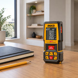 Ingco HLDD10089 laser distance detector resting on a planning desk in a contemporary apartment