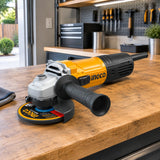 Ingco AG90028 angle grinder resting on a workbench in an organised contemporary home garage workshop.