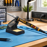 Ingco SI01610 soldering iron resting in its holder on an organised electronics repair bench
