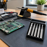 Completed circuit-board repair beside an inactive soldering iron and organised Ingco replacement tip set