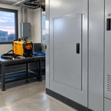 Finished steel service panel installed in a commercial plant room with an Ingco ING-CUT4058 plasma cutter nearby