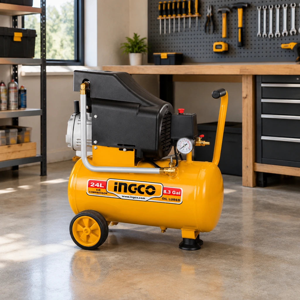 Ingco 24L air compressor parked beside an organised workbench in a clean professional workshop.