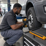 African American fleet technician using an Ingco 1/2-inch impact socket on a commercial van wheel fastener