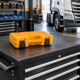 Closed orange Ingco 3/4-inch impact socket case stored on a rolling tool chest in an organised heavy-vehicle service bay.