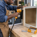 Joiner using an Ingco-compatible brad nailer loaded with ANA18501 50 mm brads to secure cabinet trim