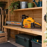 Ingco 20-inch gasoline chainsaw stored on a shelf in a clean ventilated garden equipment shed