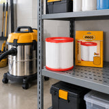 Ingco F8 replacement vacuum filter stored on a maintenance-room shelf beside its box and compatible vacuum