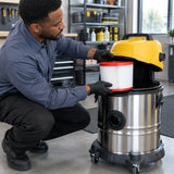Facilities technician fitting an Ingco F8 VCAIHP03 replacement filter into a compatible 75L vacuum cleaner