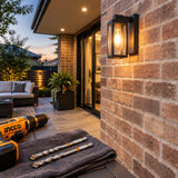 Completed brick courtyard wall fixture with Ingco masonry drill bits resting beside a parked compatible drill