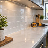 Finished contemporary kitchen backsplash with clean porcelain cuts and an Ingco diamond disc nearby