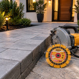 Finished courtyard paver edge with inactive compatible cutting equipment and Ingco diamond disc nearby.