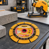 Ingco 125mm diamond cutting disc resting at an organised masonry renovation cutting station beside inactive compatible equipment.